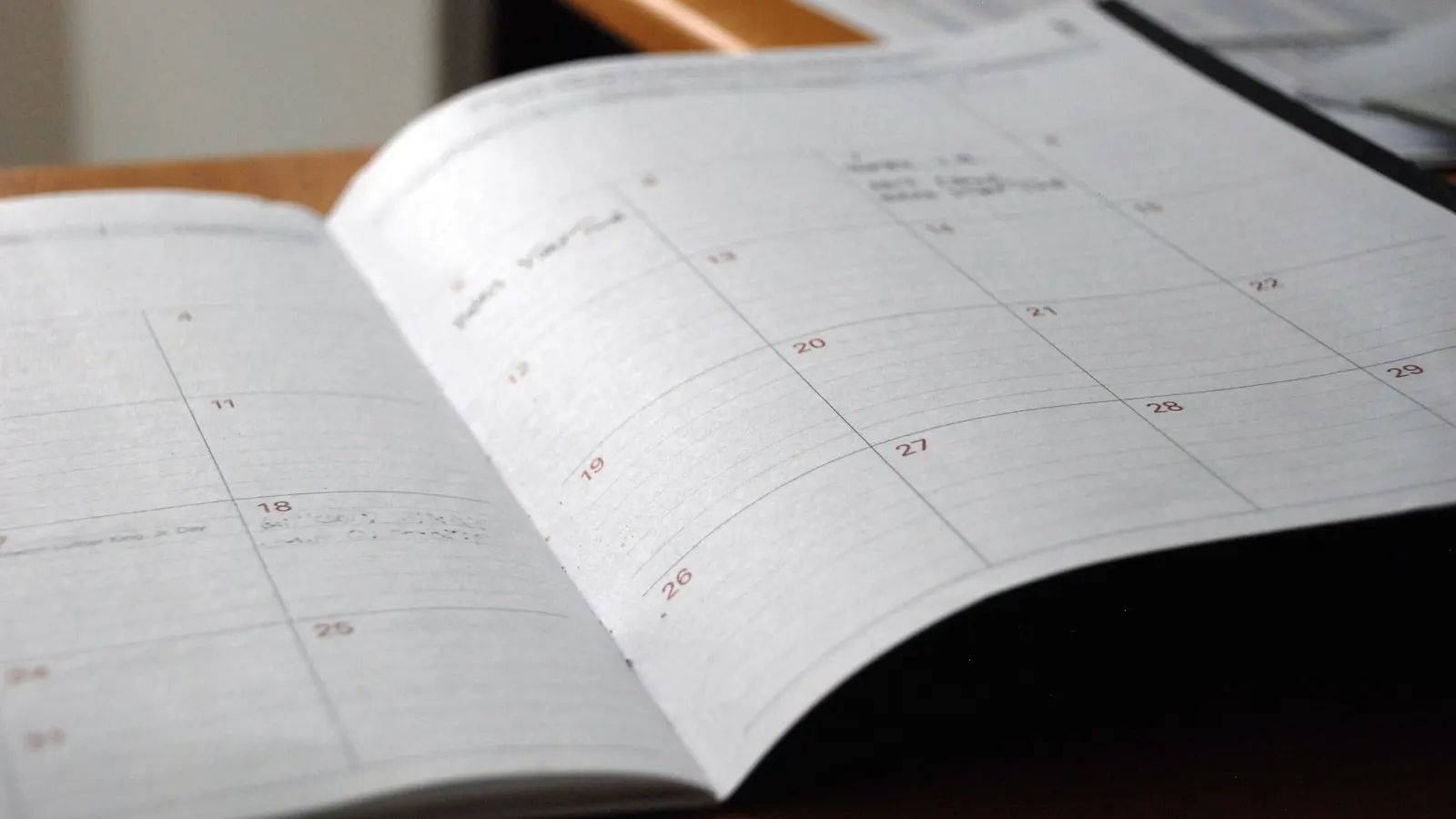 An open monthly planner on a desk