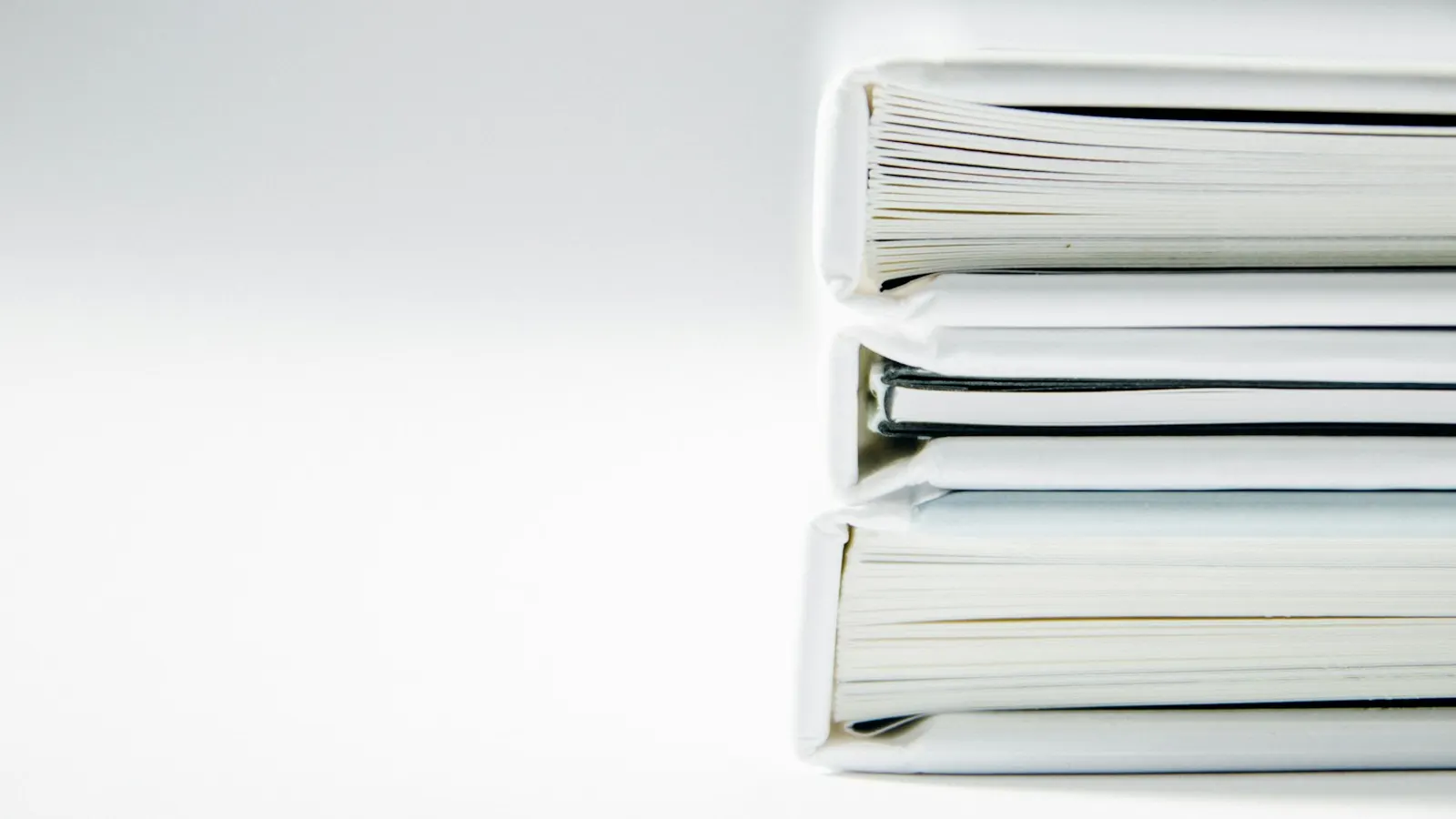 A stack of thick record folders